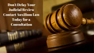 a gavel on a table Don't Delay Your Judicial Review Contact Auxilium Law Today for a Free Consultation